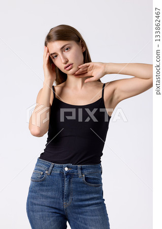 Slavic beauty in black top posing confidently 133862467