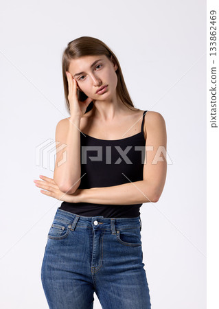 Slavic beauty in black top posing confidently Slavic beauty in black top posing confidently 133862469