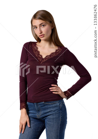 Slavic woman in burgundy lace top and jeans Slavic woman in burgundy lace top and jeans 133862476