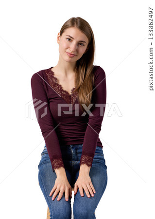 Slavic woman smiling gently in studio portrait 133862497