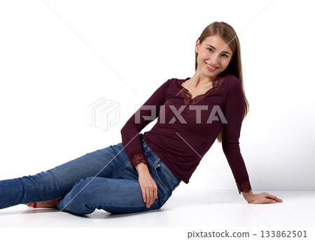 Slavic woman smiling gently in studio portrait Slavic woman smiling gently in studio portrait 133862501