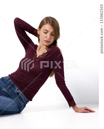 Slavic woman in lace top posing on floor Slavic woman in lace top posing on floor 133862503