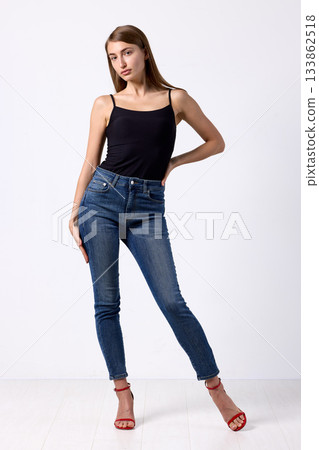 Slavic beauty in black top posing confidently 133862518