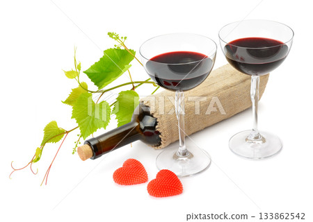 Romantic Red Wine Glasses, Grape Vine, and Heart-Shaped Candles Romantic Red Wine Glasses, Grape Vine, and Heart-Shaped Candles 133862542