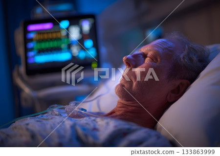 A doctor monitors a patient sleeping connected to medical equipment. 133863999