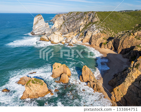 Cabo da Roca, Ursa Beach, Cliffs and Atlantic Ocean Waves on Sunny Day. Aerial View. Portugal Cabo da Roca, Ursa Beach, Cliffs and Atlantic Ocean Waves on Sunny Day. Aerial View. Portugal 133864751