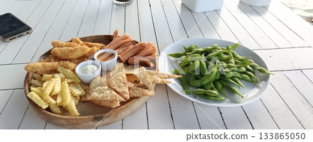 Jepara, Indonesia - November 18 2025: Snacking at Beach 133865050