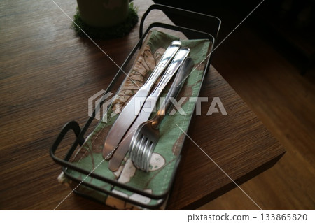 Silverware on the wooden table in the restaurant Silverware on the wooden table in the restaurant 133865820