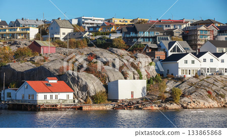 A serene coastal town scene featuring wooden houses, Kristiansund A serene coastal town scene featuring wooden houses, Kristiansund 133865868