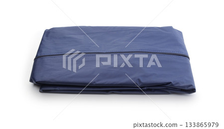 Folded raincoat isolated on white. Folded raincoat isolated on white. 133865979