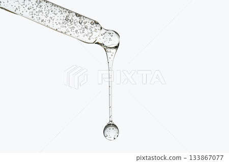 Cosmetic pipette dropping clear hyaluronic acid serum 133867077