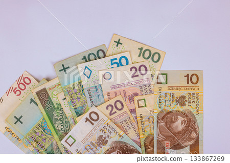 Collection of Polish Zloty banknotes arranged on plain surface various denominations 133867269