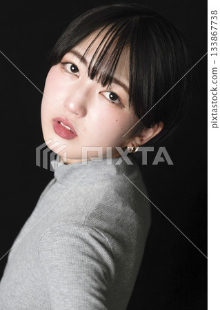 Beautiful woman's gaze on black background Beautiful woman's gaze on black background 133867738