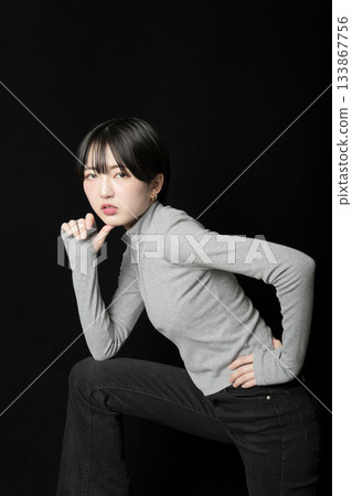 Beautiful woman's gaze on black background 133867756