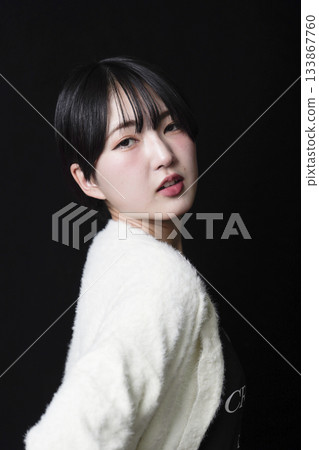 Beautiful woman's gaze on black background Beautiful woman's gaze on black background 133867760