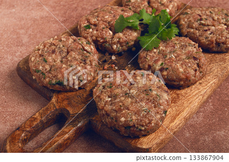 raw cutlets, minced meat, on a chopping board, homemade, top view, no people, raw cutlets, minced meat, on a chopping board, homemade, top view, no people, 133867904
