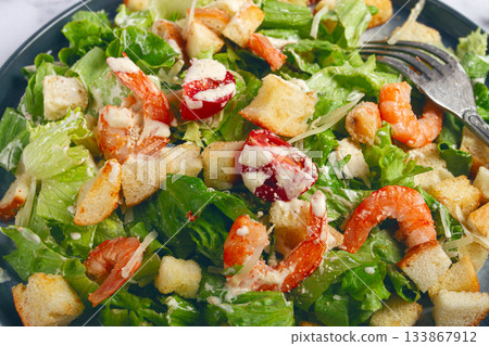 Caesar salad, with shrimp, on a marble background, top view, no people, 133867912