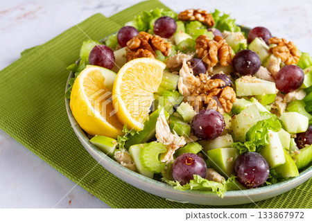 Fresh Waldorf salad, celery stalk with chicken, apple and walnuts, grapes, herbs, homemade, without people, Fresh Waldorf salad, celery stalk with chicken, apple and walnuts, grapes, herbs, homemade, without people, 133867972