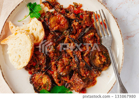 stewed meat with eggplant is a Georgian dish, on a light background,homemade, no people 133867980