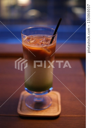 A beautifully gradient matcha latte and iced milk drink A beautifully gradient matcha latte and iced milk drink 133868037