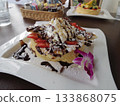 Pancakes with gorgeous chocolate and berries and a resort cafe dish 133868075