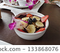 A healthy morning with an acai bowl decorated with granola and berries 133868076