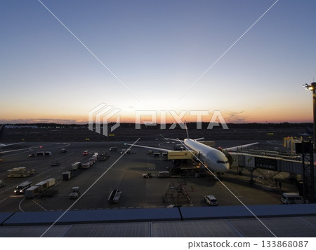 The start of the journey as the runway bathed in the sunset and a jet plane greets us. The start of the journey as the runway bathed in the sunset and a jet plane greets us. 133868087