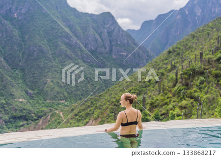 Female tourist exploring Grutas Tolantongo in Mexico, enjoying natural hot springs, scenic caves, and outdoor adventure. Travel, wellness, and sightseeing concept 133868217