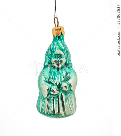 Vintage green glass Christmas figurine ornament with painted details isolated on white background. 133868637