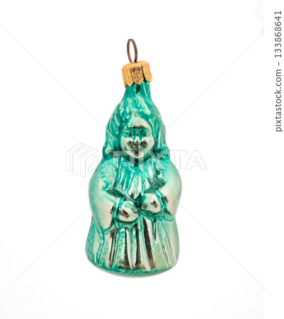 Vintage green glass Christmas figurine ornament with painted details isolated on white background. 133868641