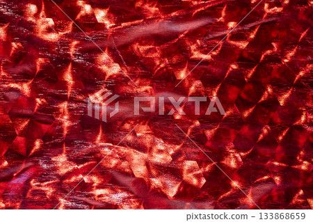 Vibrant red abstract texture with crystal-like facets and metallic glare 133868659