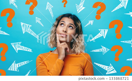 Engaging young woman pondering questions with colorful background and arrows in a creative setup Engaging young woman pondering questions with colorful background and arrows in a creative setup 133868721