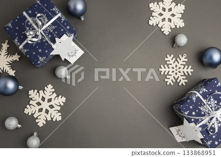 Blue Christmas Gift Boxes with Silver Ribbons and Snowflake Decorations 133868951