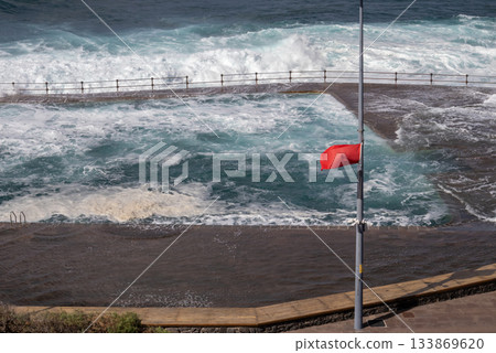 Red flag on the Atlantic ocean beach, Tenerife, Spain 133869620