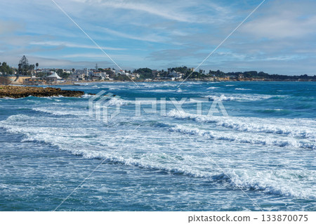 Sicilian seaside view with sunny Mediterranean waves. Sicilian seaside view with sunny Mediterranean waves. 133870075