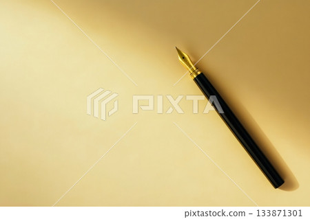 Fountain pen with a golden nib rests on a peaceful beige background, representing literature, business, and elegance 133871301