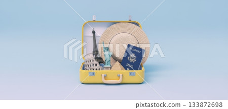 Yellow open suitcase packed with a passport, straw hat, and famous landmarks like the eiffel tower, statue of liberty, colosseum, and pyramid, symbolizing global tourism and vacation planning 133872698