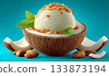 Delicious coconut ice cream served in a coconut shell with almonds and mint leaves on a bright background 133873194