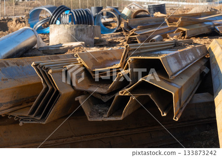 A close-up shot of several interlocking steel sheet piles 133873242