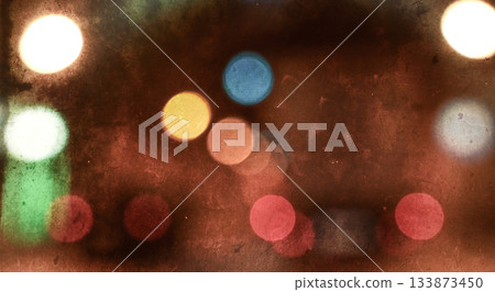 Colorful vintage bokeh background with film scratches and grain Colorful vintage bokeh background with film scratches and grain 133873450