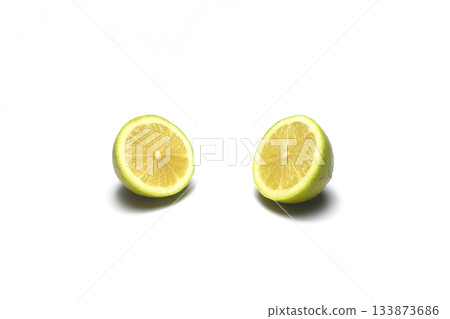 Whole Green Lemon , half and slice, isolate on white background with clipping paths. Whole Green Lemon , half and slice, isolate on white background with clipping paths. 133873686
