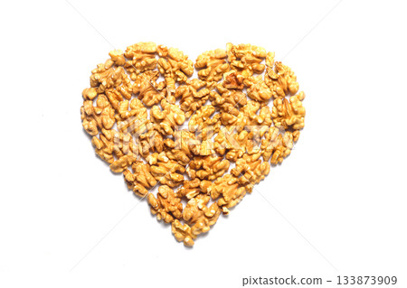 walnut in the shape of a heart on a white background. walnut in the shape of a heart on a white background. 133873909