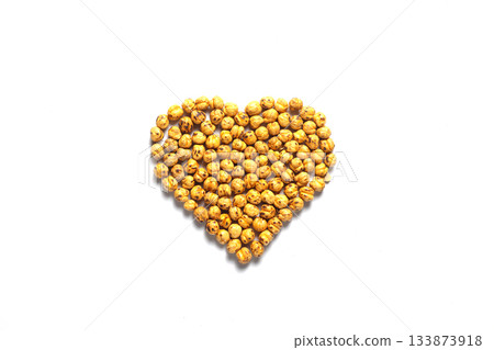 Heart shape Leblebi or Roasted Chickpea on a white background. Healthy organic food high in fibre, vitamins, minerals, protein. On white background. Flat lay, top view. Heart shape Leblebi or Roasted Chickpea on a white background. Healthy organic food high in fibre, vitamins, minerals, protein. On white background. Flat lay, top view. 133873918