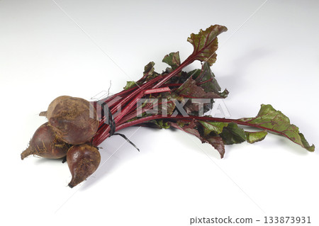 bundle of fresh organic garden beet roots with greens isolated on white background bundle of fresh organic garden beet roots with greens isolated on white background 133873931