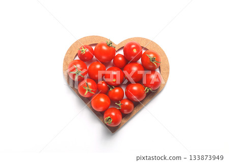 heart shaped tomatoes on a white background. 133873949