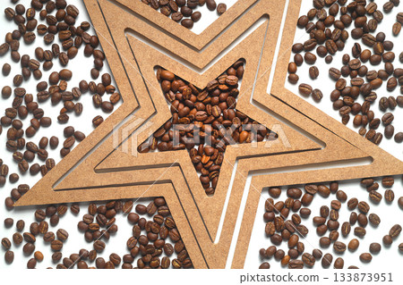 Roasted coffee beans shaping star on white background. 133873951