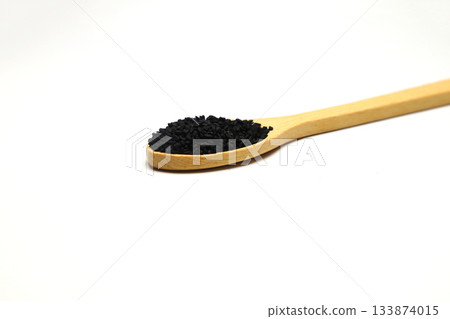 Nigella sativa or Black cumin in wooden spoon isolated on white background 133874015