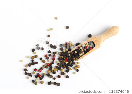 Pepper mix in scoop isolated on white background, top view Pepper mix in scoop isolated on white background, top view 133874046