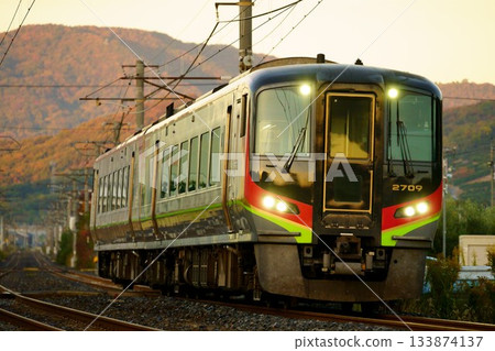 The Shimanto express train passing through a residential area The Shimanto express train passing through a residential area 133874137