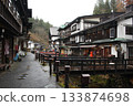 Rainy hot spring town 133874698